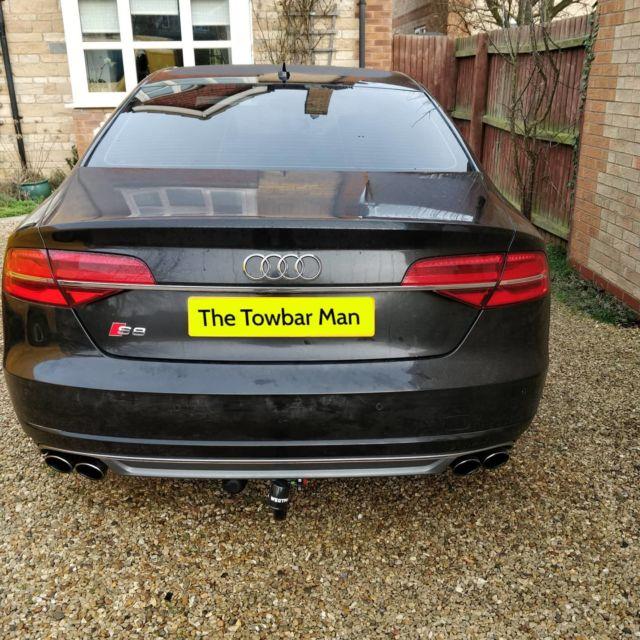 Professional towbar installation on vehicle